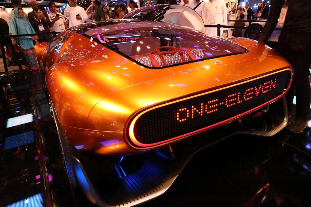 a futuristic car on display at a convention