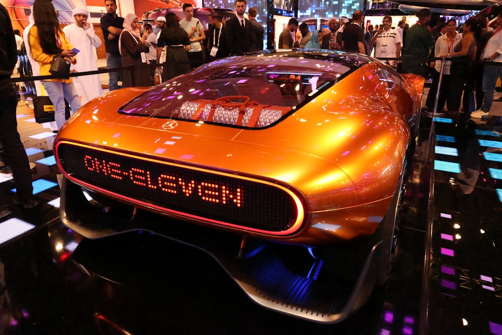 a futuristic car is on display at a show