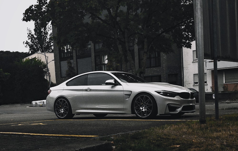 a silver car parked on the side of the road