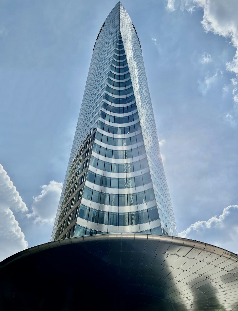 a very tall building with a sky background