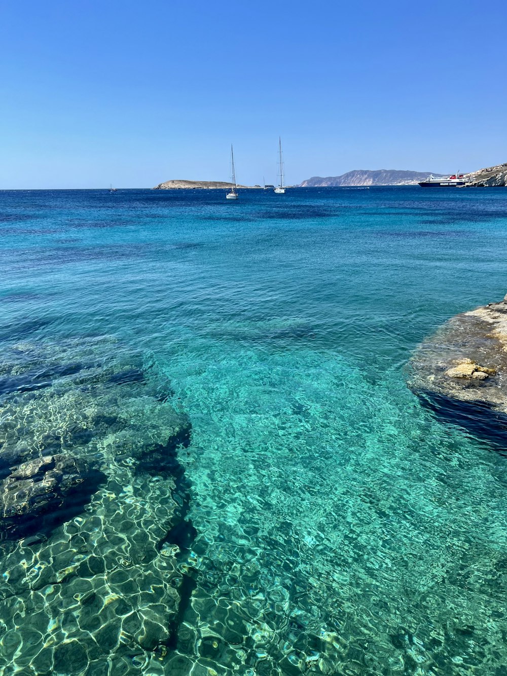 a body of water with a boat in the distance