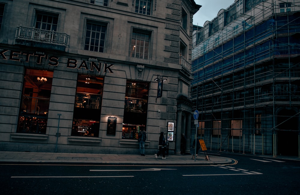 a street corner with a building and a street sign