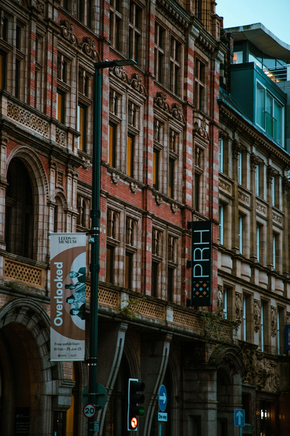 a street light in front of a large building