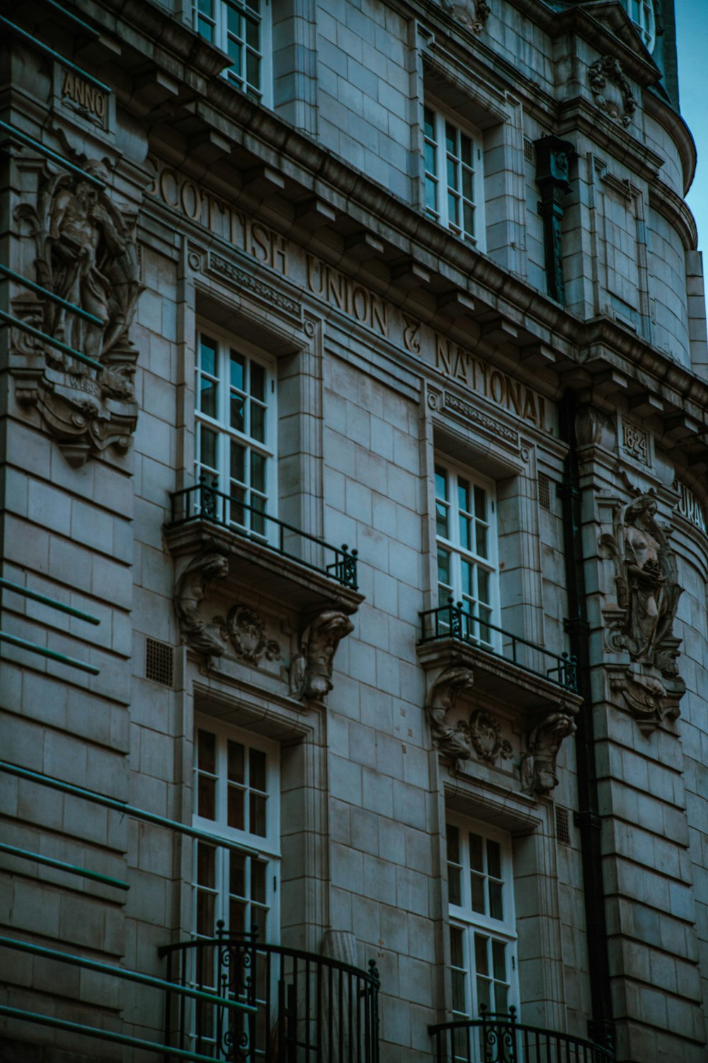 a tall building with a clock on the front of it