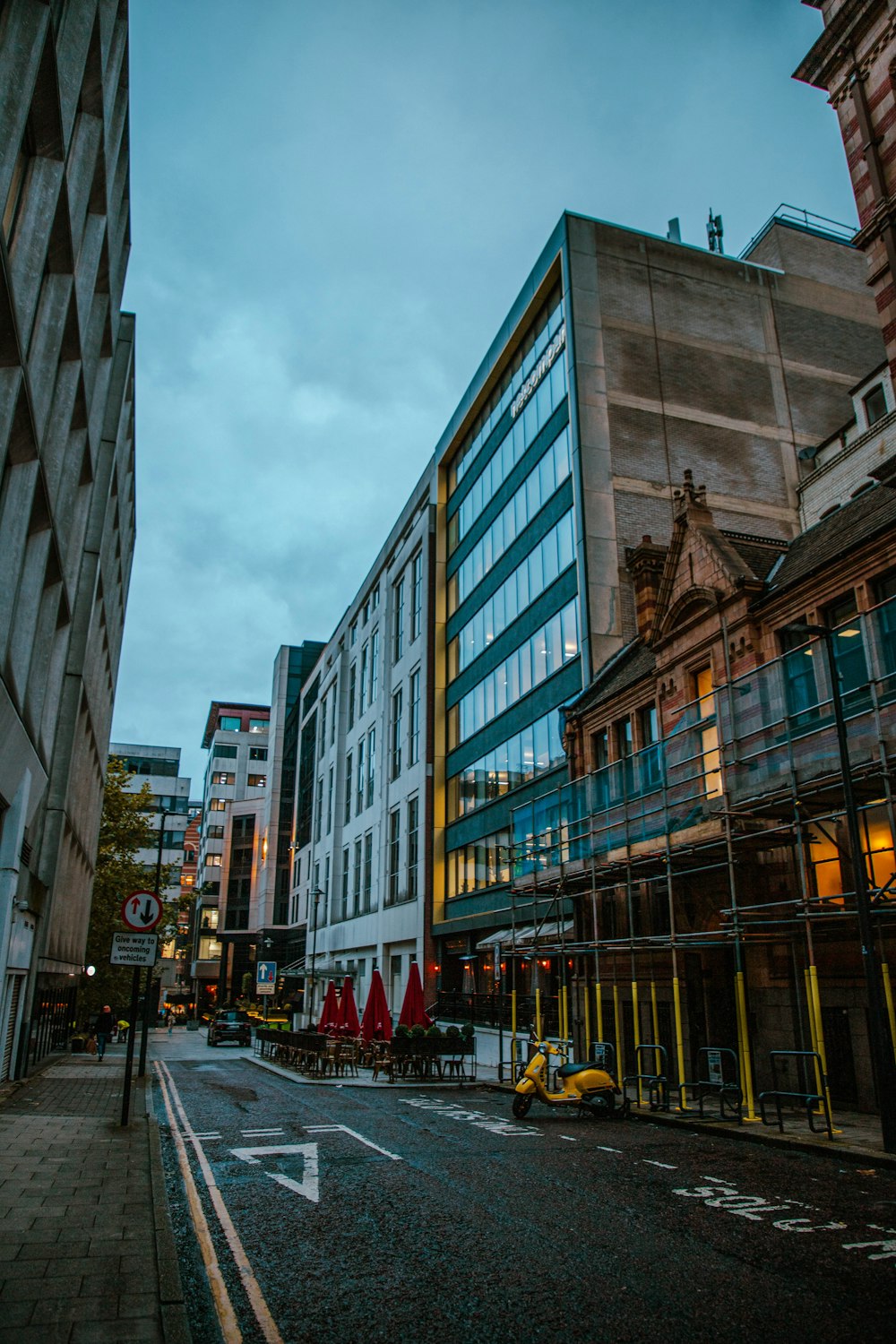 a city street with tall buildings on both sides