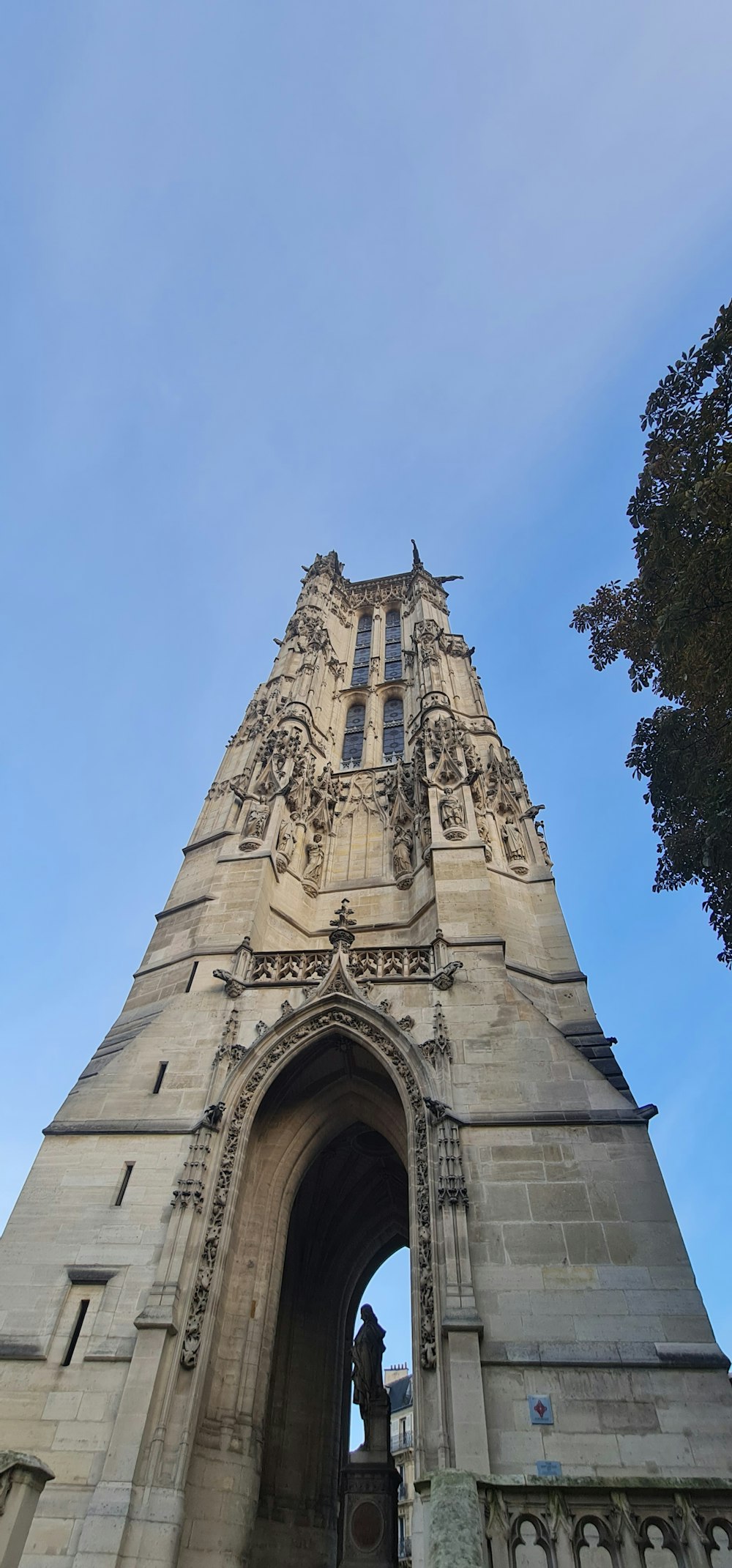 a tall tower with a clock on the top of it