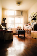 A cozy living room with a visible air conditioning unit, showcasing a comfortable environment.