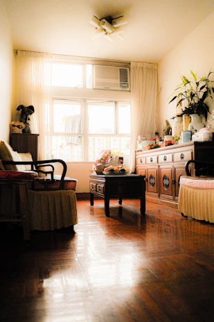 Cozy living room featuring beautifully refurbished wooden furniture ready for resale.