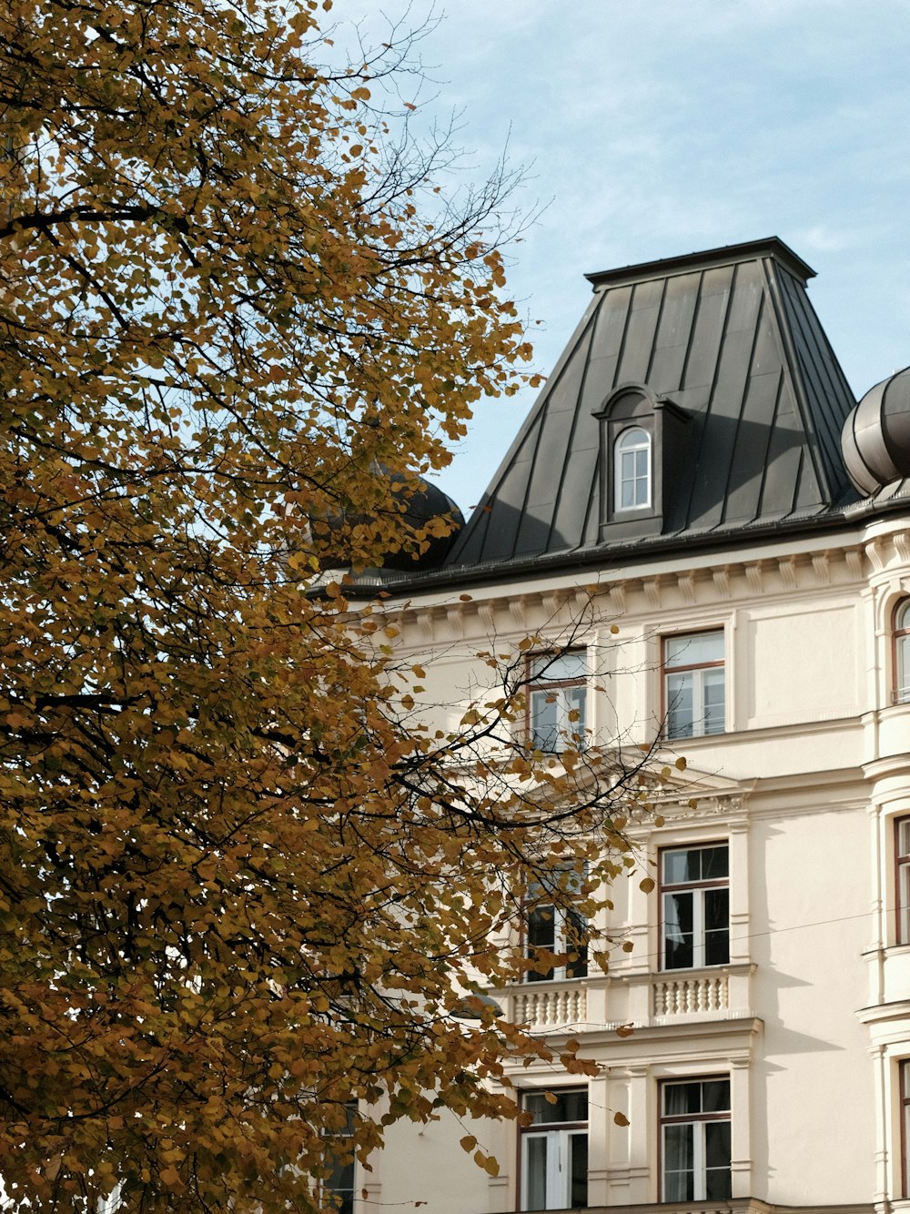 a tall building with a clock on the top of it