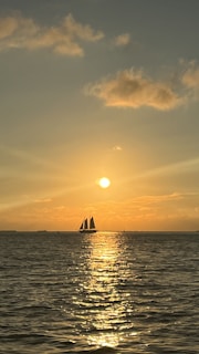 A stunning sunset over the ocean with Novera sailing.