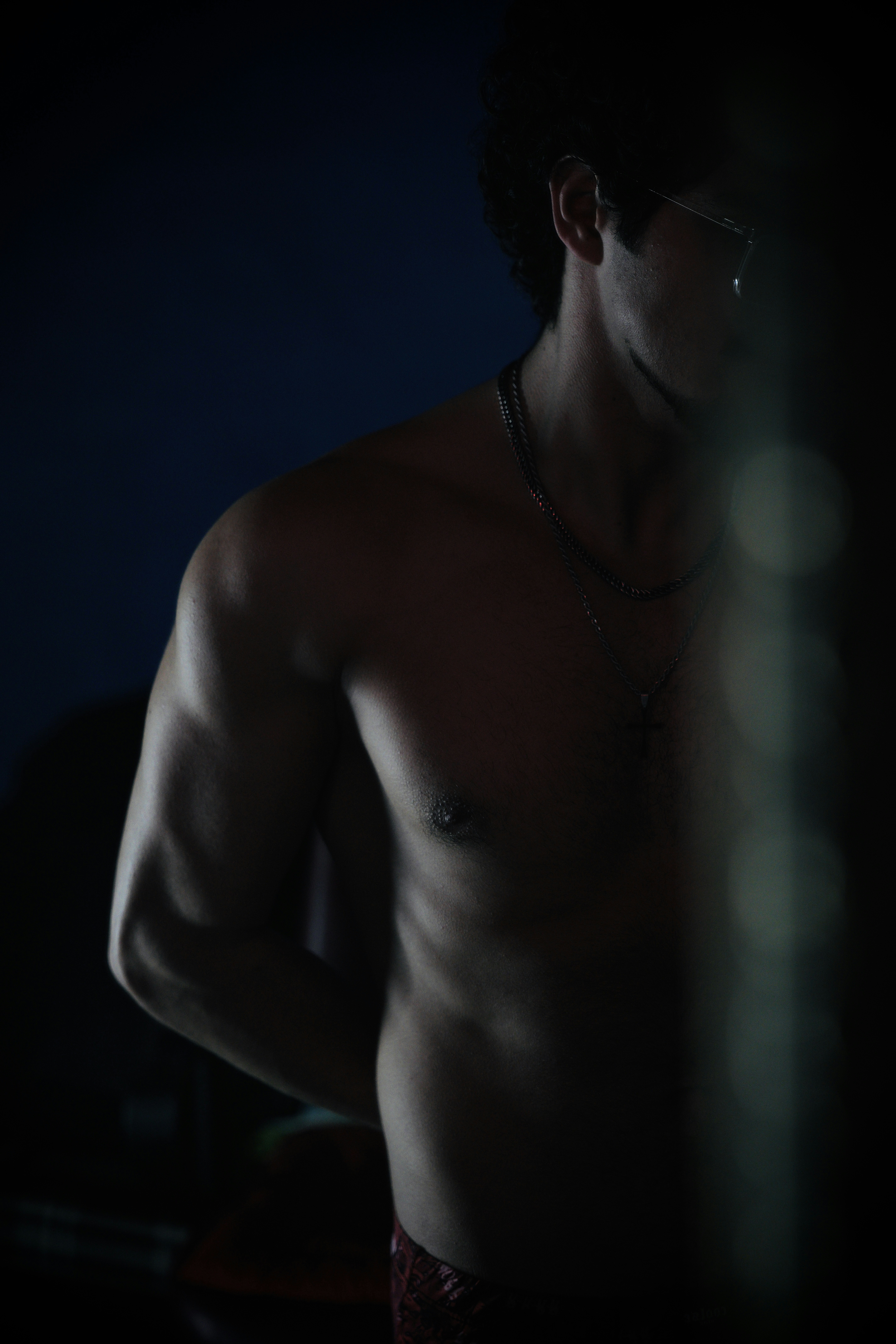 A shirtless man wearing a chain around his neck photo – Free Photography Image on Unsplash