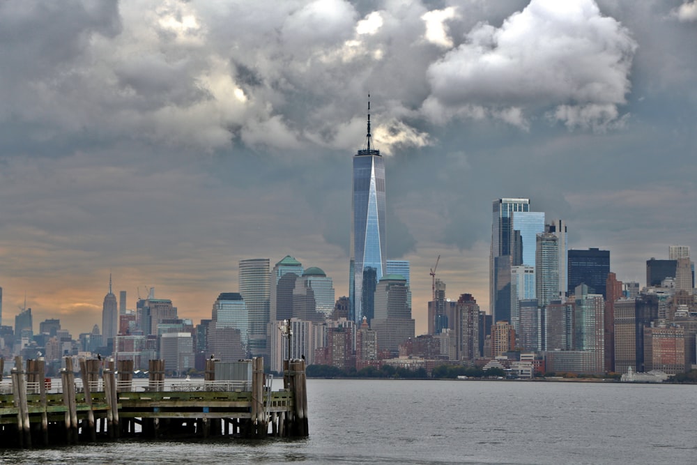 a view of a city skyline with clouds in the sky