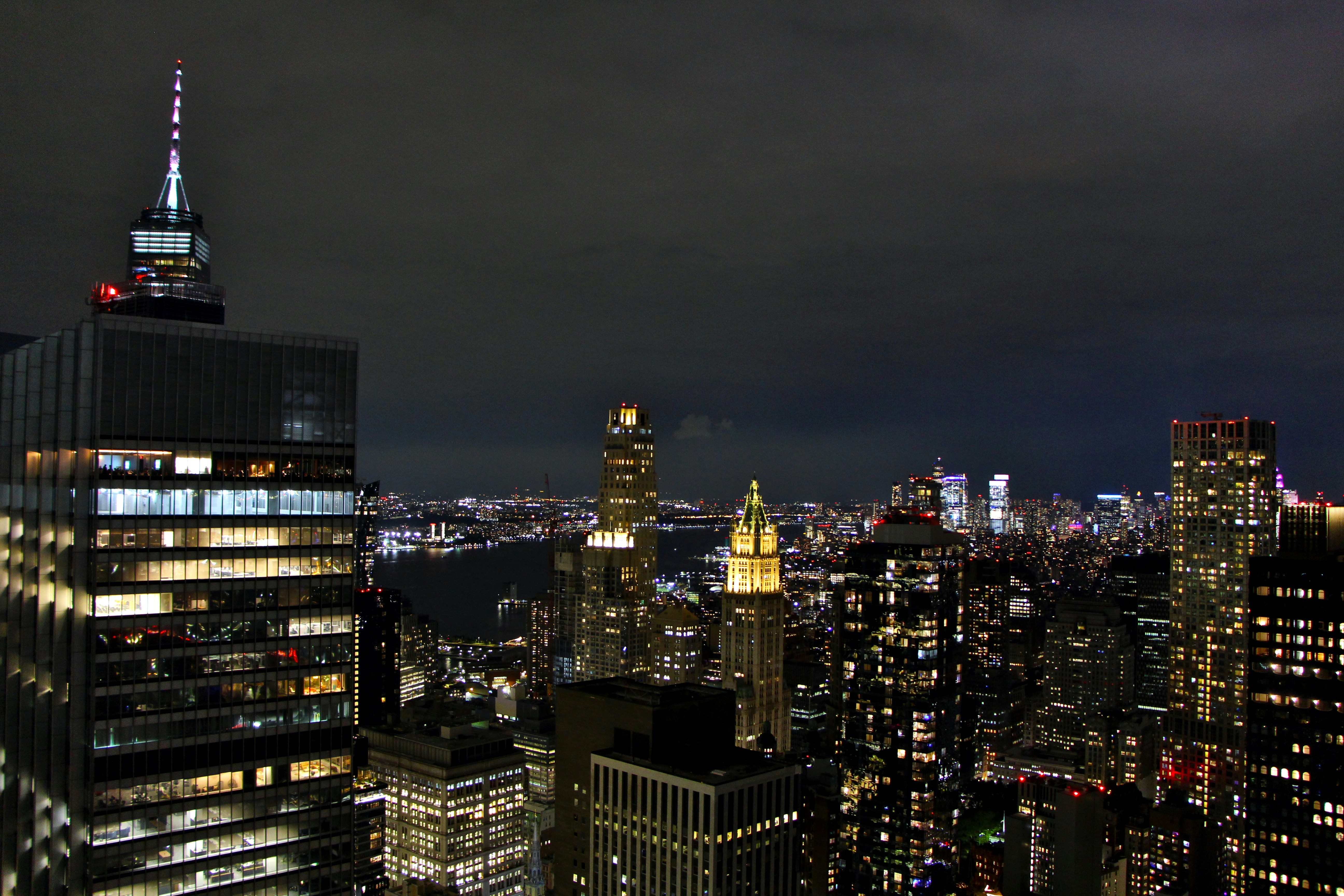 a view of a city at night from the top of a building