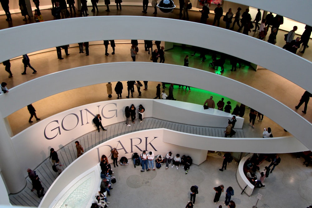 a group of people standing inside of a building