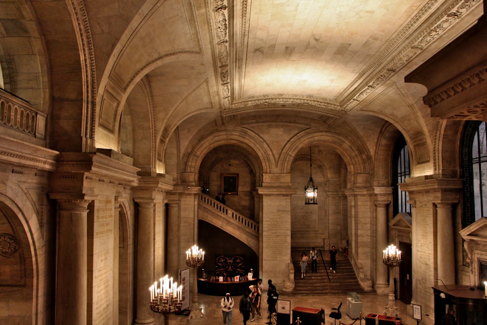 a large building with a bunch of chandeliers hanging from the ceiling