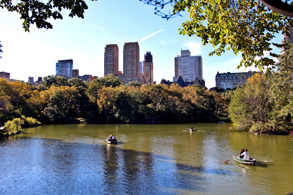 a couple of boats floating on top of a lake