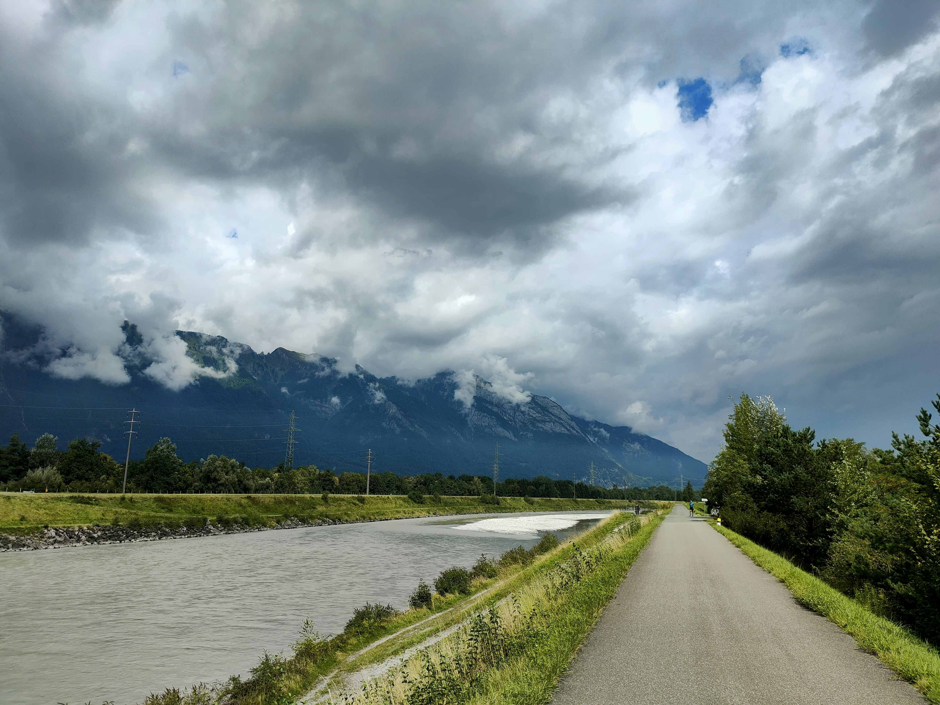 a scenic view of a mountain range and a river