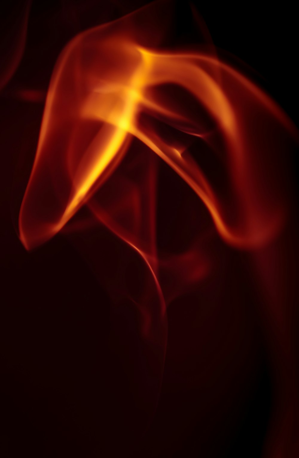 a close up of a red and yellow smoke