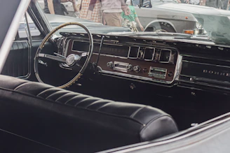 Soft-focus shot of a retro dashboard with elegant typography and chrome details.