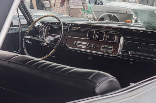 Soft-focus shot of a retro dashboard with elegant typography and chrome details.