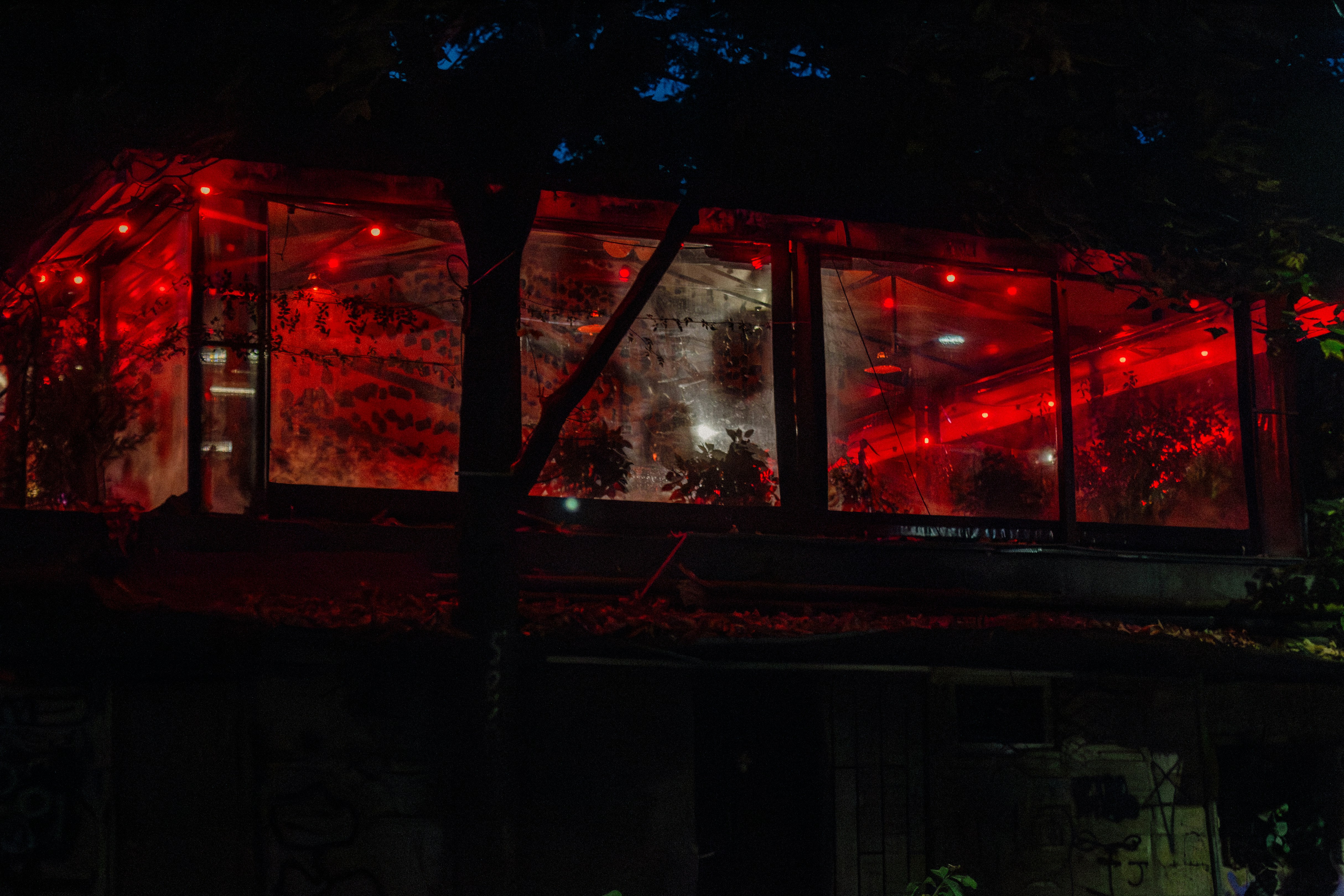 a building with red lights in the windows, 