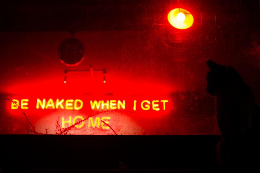 a neon sign that says be naked when i get vcms