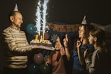 A family celebrating a special occasion with cake and smiles.