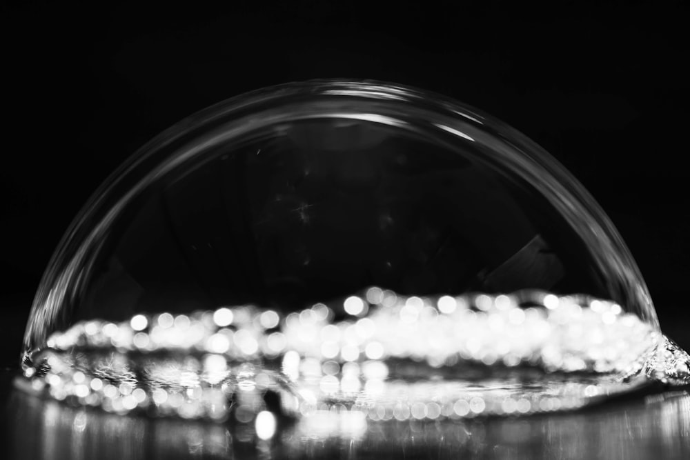 a black and white photo of a glass bowl