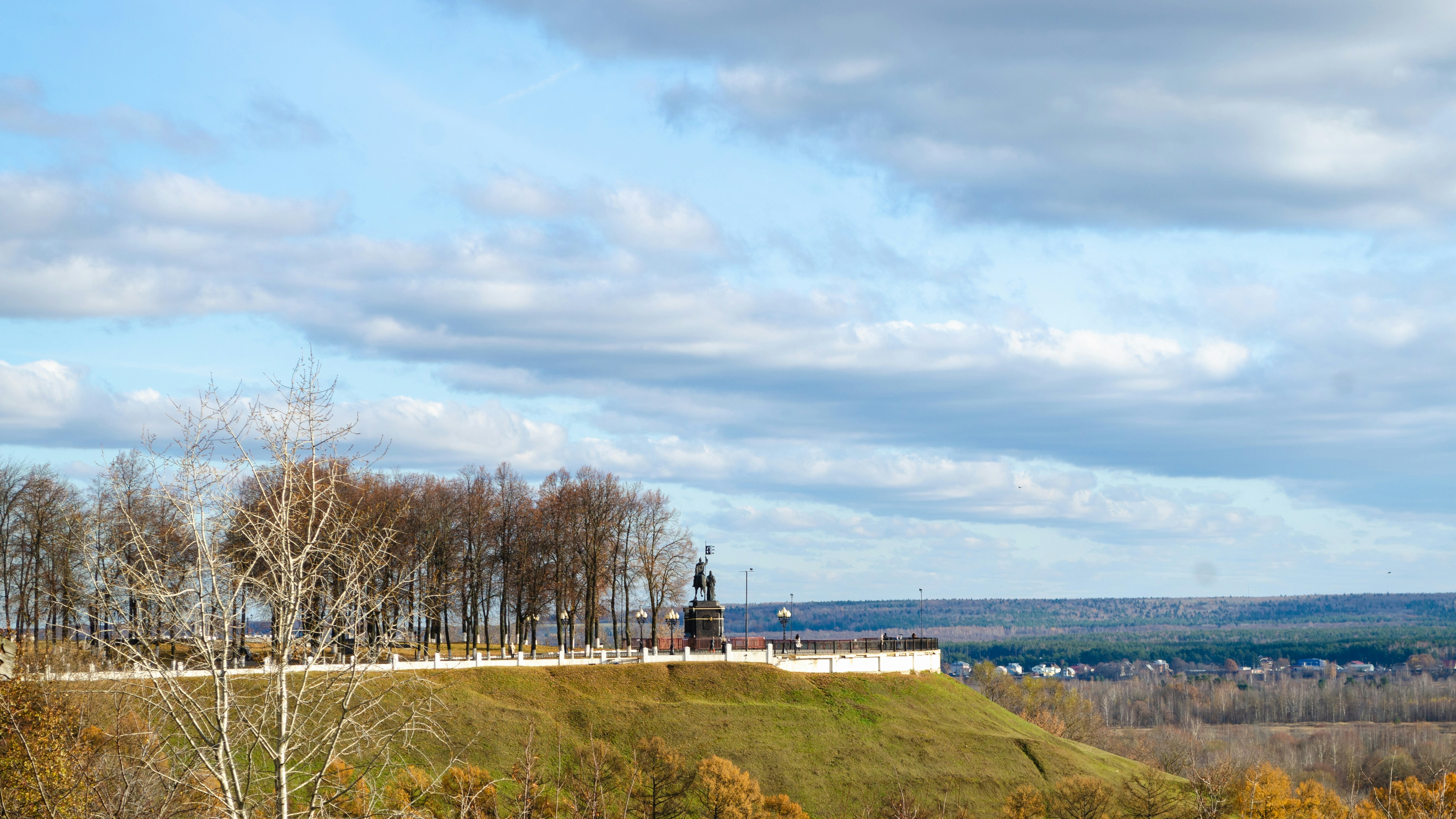 a hill with a clock tower on top of it