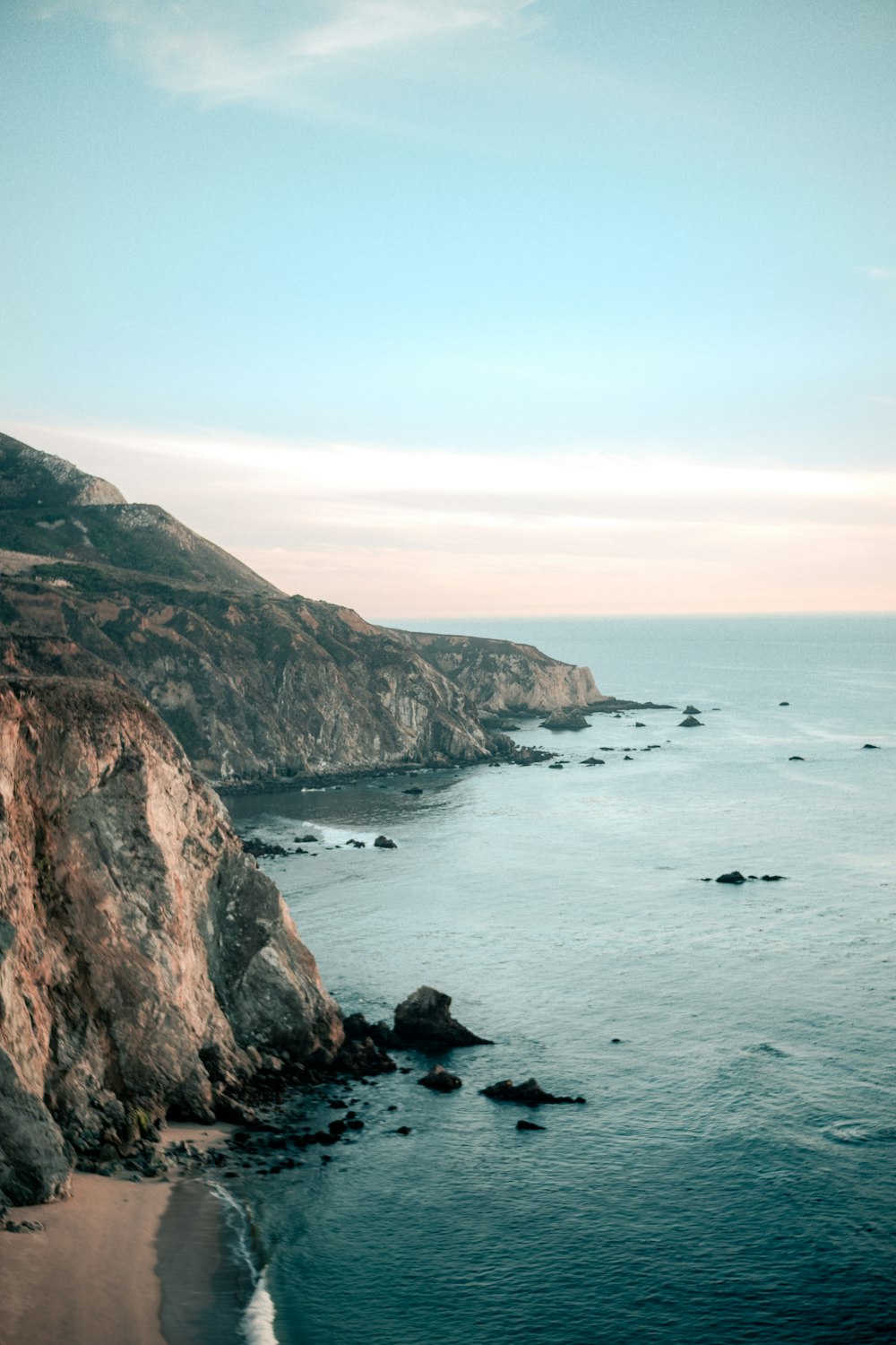 a view of the ocean from a cliff