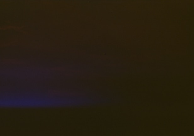 Footer area styled in darkmode with subtle gray icons and links.