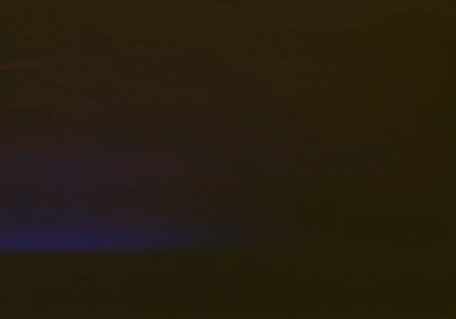 A sleek dark mode interface showing image editing tools with vibrant red highlights on a deep blue-gray background