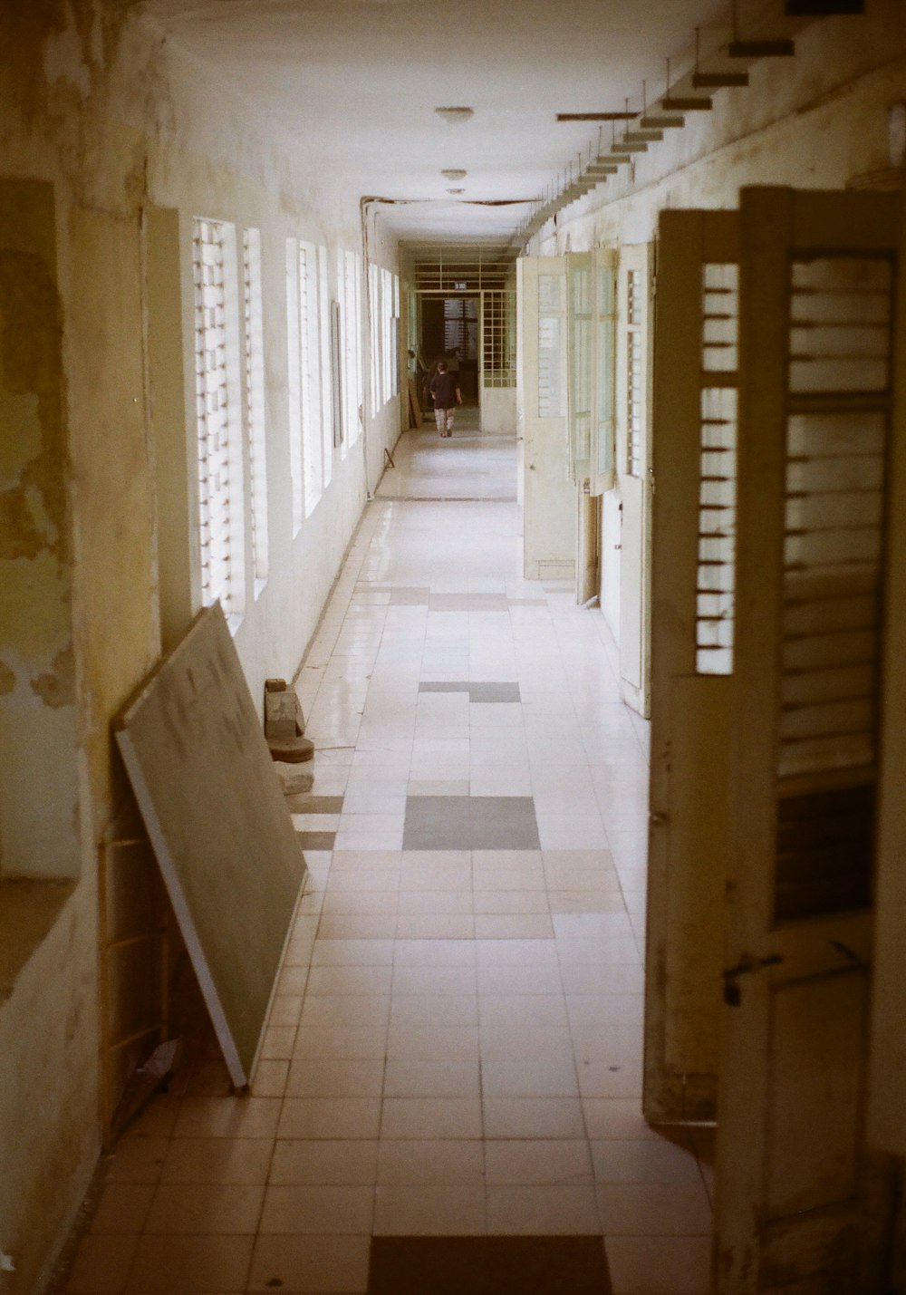 a long hallway with a bunch of windows