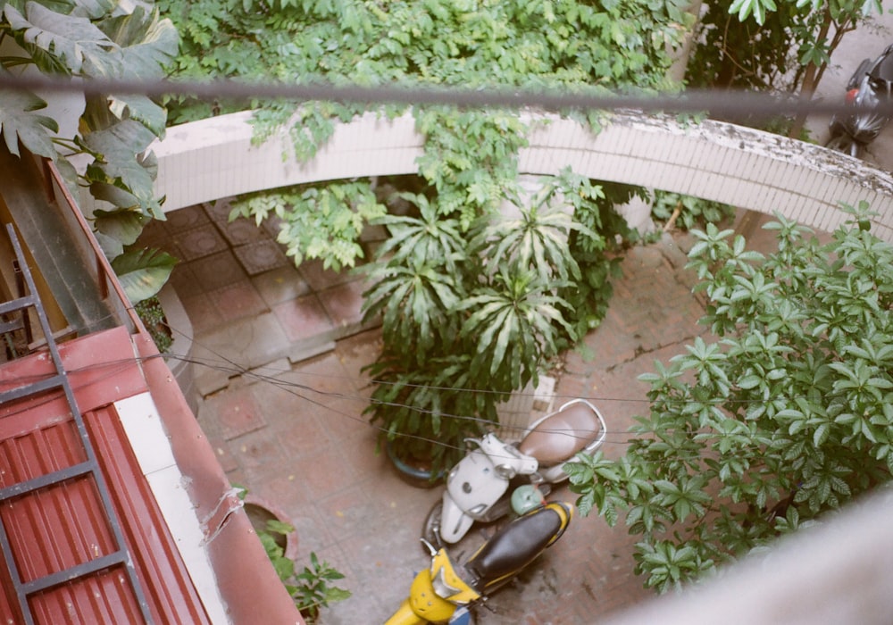 an aerial view of a motor scooter parked in a garden