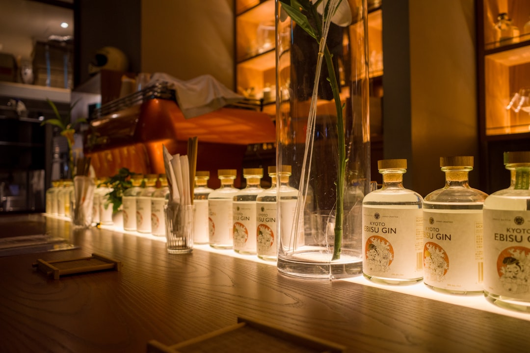 a row of bottles lined up on a table,