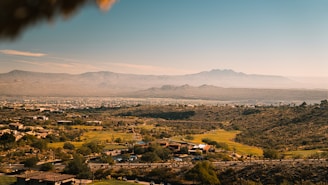 A stunning aerial view of Summerlin's luxury homes nestled among desert landscapes under a clear blue sky.