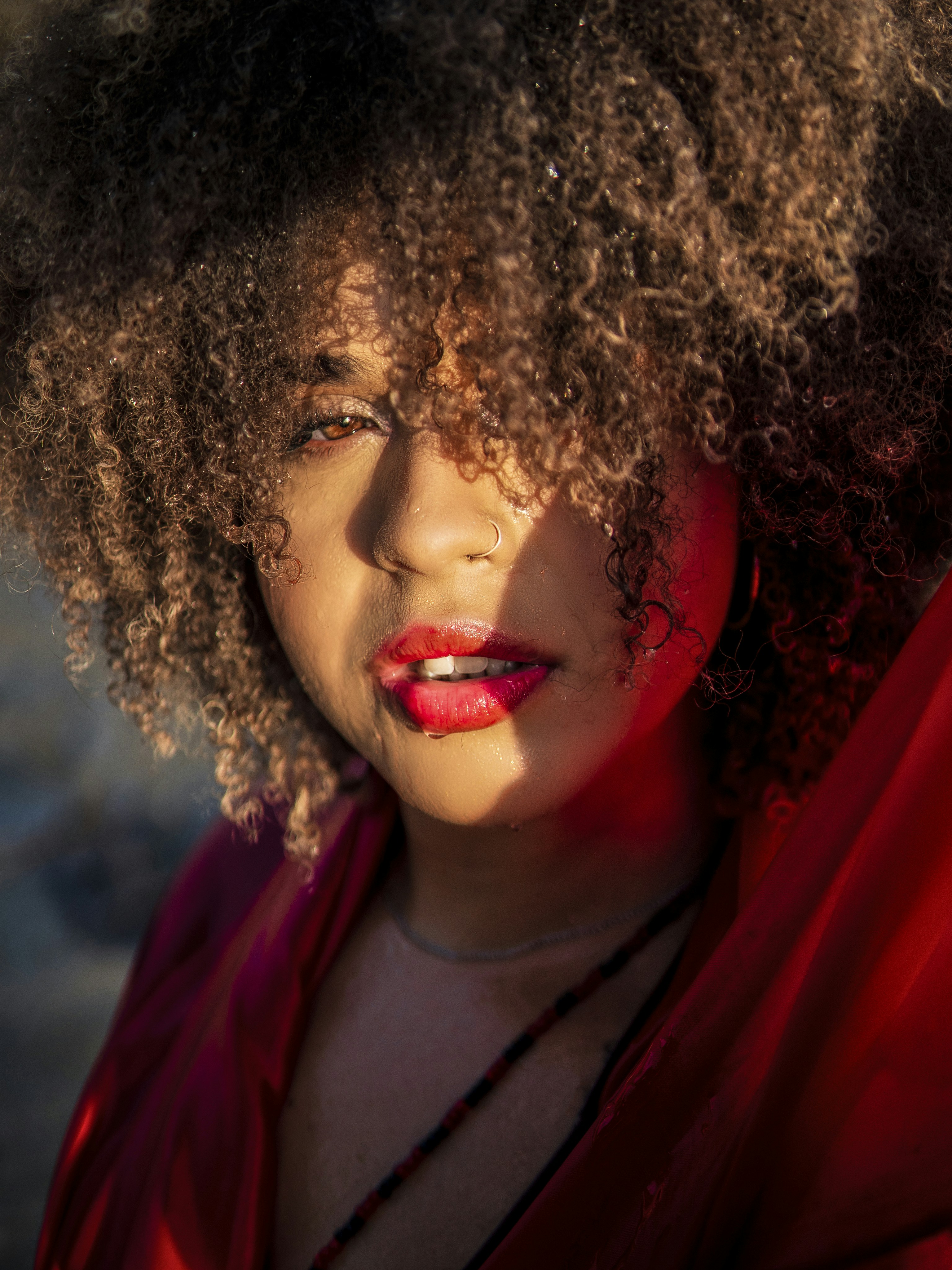 a close up of a person with an afro