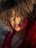 a close up of a person with an afro