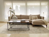Elegant beige sofa set with wooden legs in a modern living room