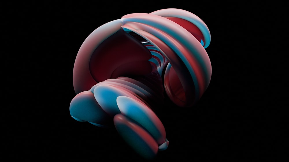 a red and blue object with a black background