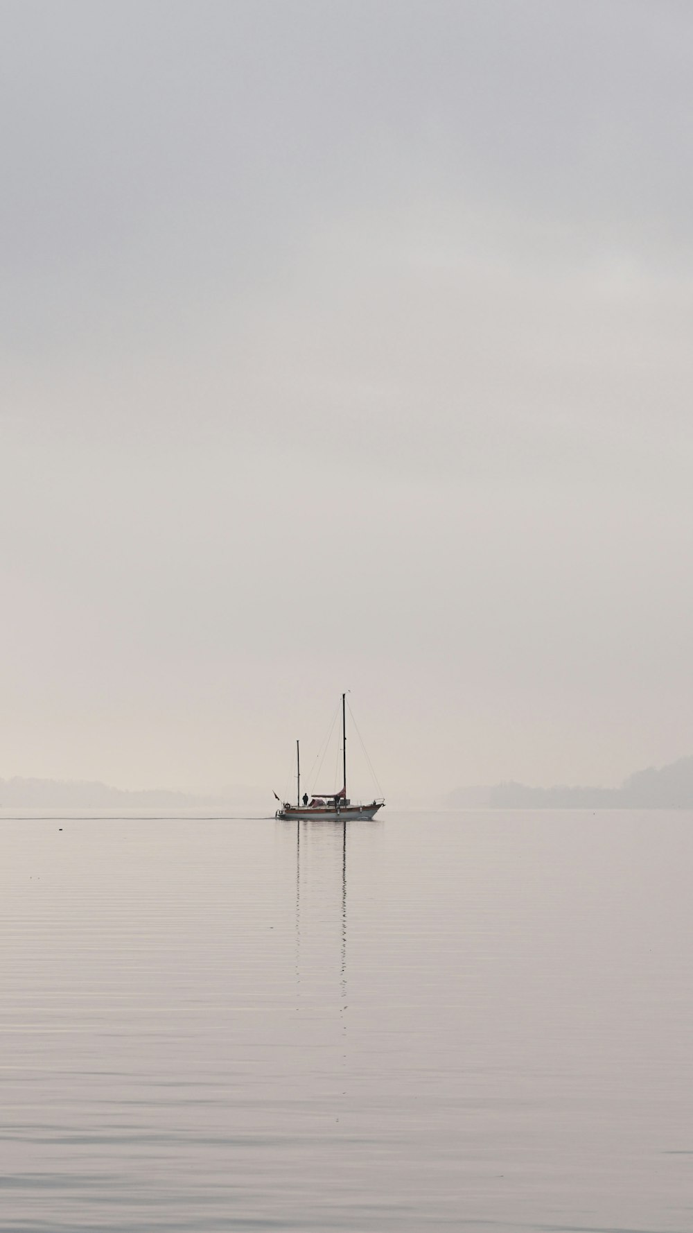 a boat floating on top of a large body of water