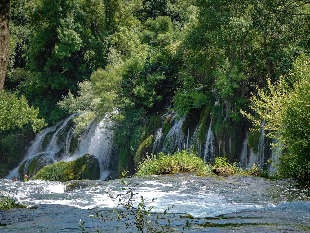 a river with a waterfall in the middle of it