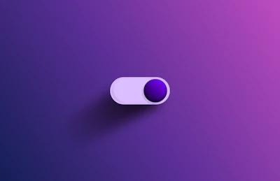 a purple and white object on a purple background