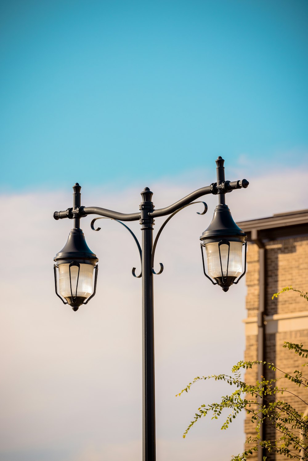 a lamp post with two lights on top of it