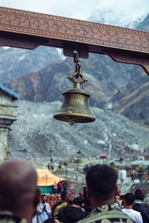 a bell hanging from the side of a building