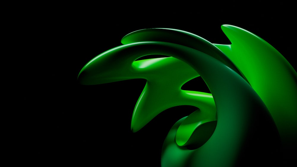 a close up of a green object on a black background