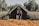 A happy customer standing in front of their new home in Lombok.