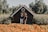 A happy customer standing in front of their new home in Lombok.