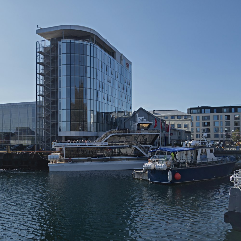 a large building sitting next to a body of water