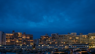 Evening view of residential towers with illuminated windows